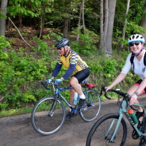 Two alumni enjoying the bike ride to Conneaut Lake.