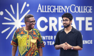 Professor of Economics Steve Onyeiwu with Yogesh Gupta during July 2026 ACRoSS research presentation