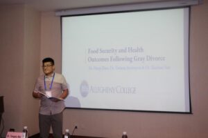 Professor Zhao presenting his research at the 5th International Conference on Aging and Gerontology (ICAG 2024) in Kunming, China.