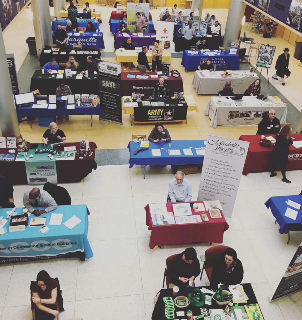 Click to view enlarged photo of employers setting up for the 2018 work local job fair. 