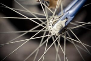 Blurry photo of bike spokes.