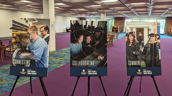 Three posters on tripods, one labeled "Connecting", one labeled "Collaborating", and one labeled "Community", with the logo for the Center for Faculty Research and Teaching Excellence.