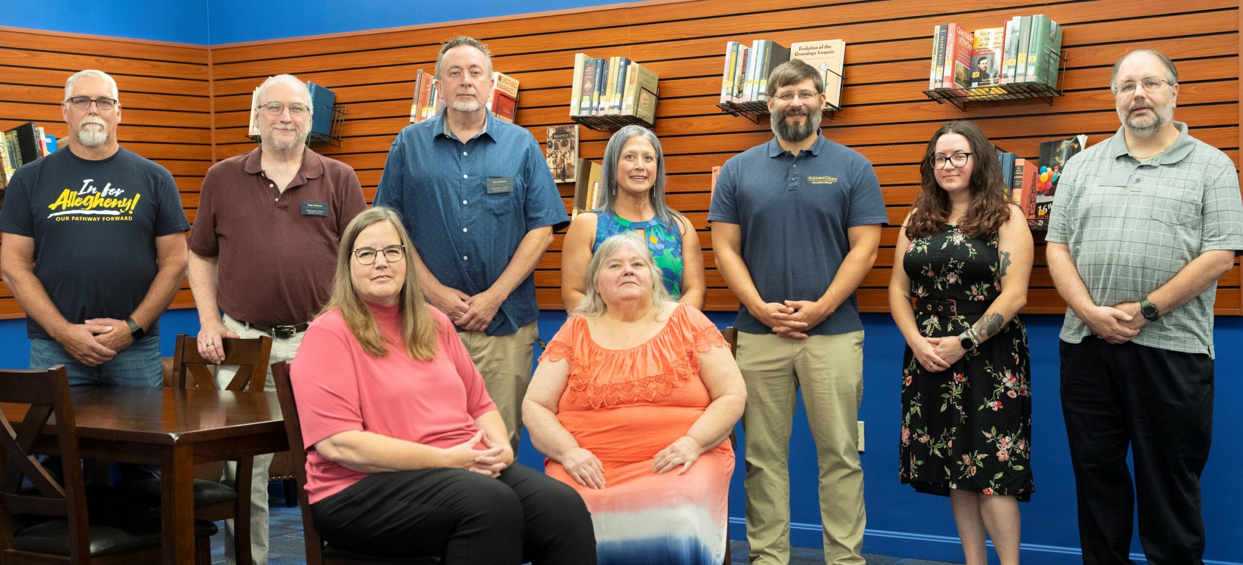 A photo of the library staff as of August 2025 -- 9 people.