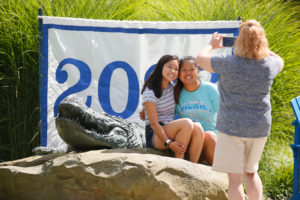 Students photographed at the Class of 2023 sign and Gator sculpture