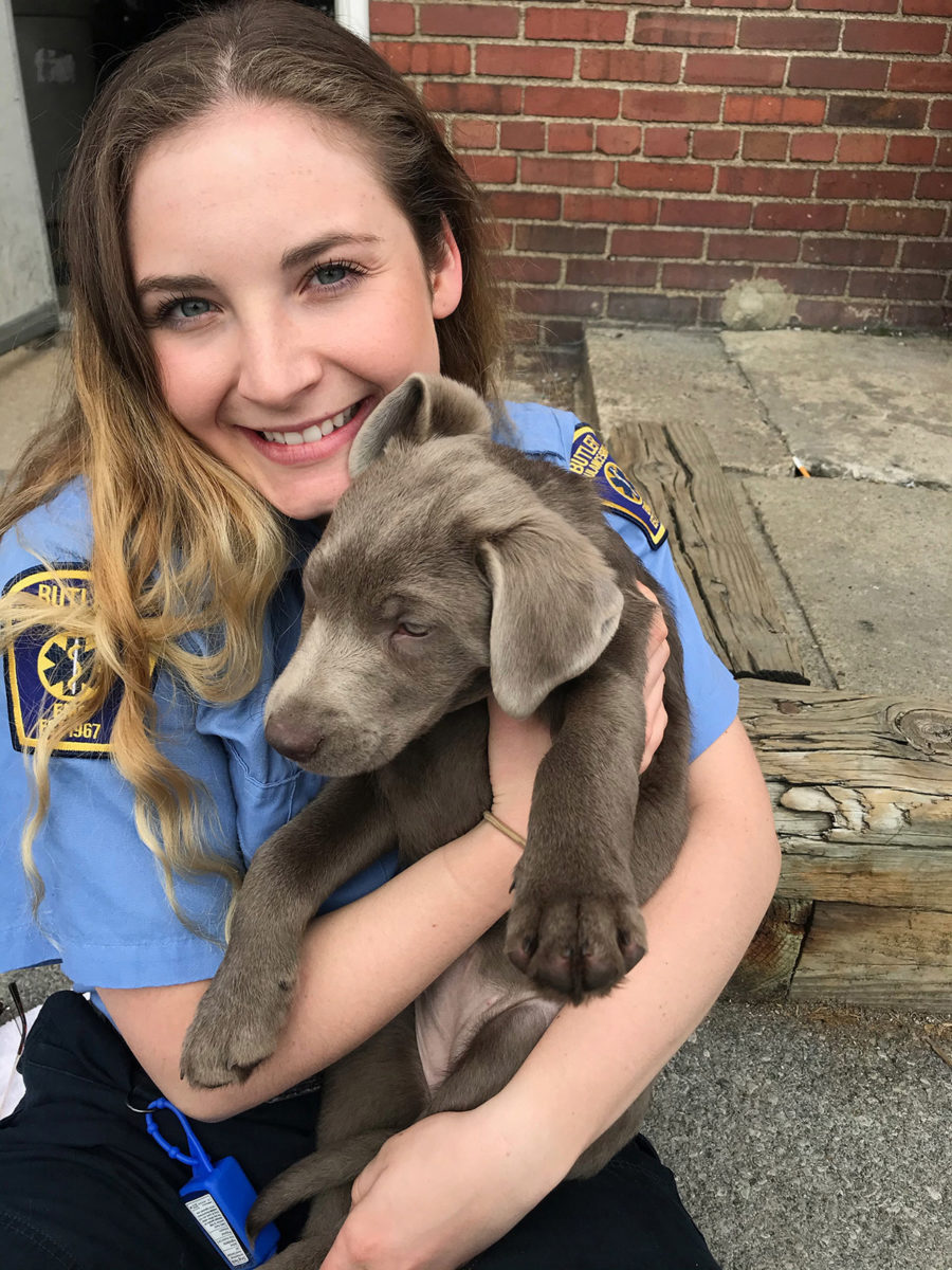Allegheny student Sarah Foster with a puppy