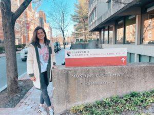 Gabby Culotta posing in front of Harvard Graduate School of Education sign 
