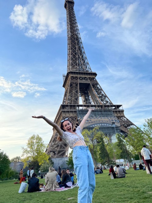 Allegheny student Faythe Schulte with the Merchant Logo Eiffel Tower in the background