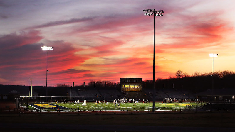 sunset above an athletic field