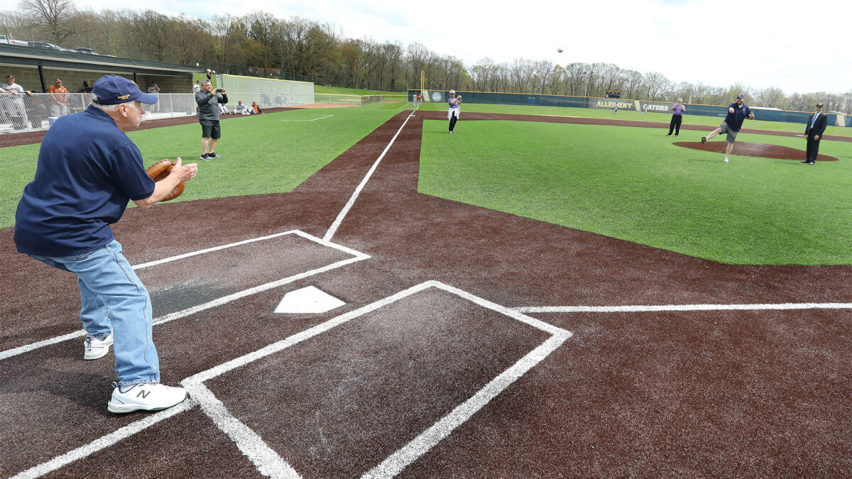 Ceremonial first pitch at the dedication of Allegheny College's Robert M. Garbark Field