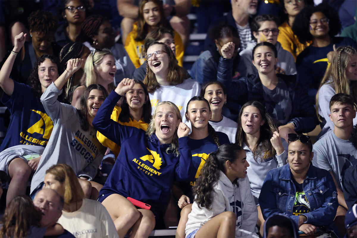 Students cheering at football game