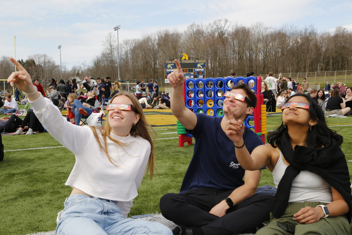 Students with eclipse glasses