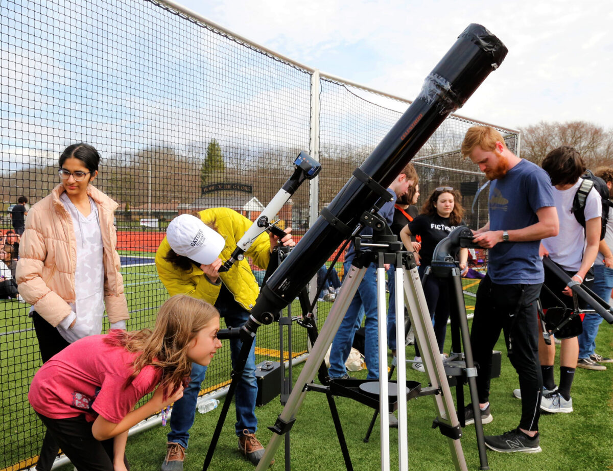Guests trying out a telescope