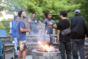 Members of Allegheny College’s RISE community enjoy a bonfire on campus, Aug. 13, 2024. Photo by Ed Mailliard.