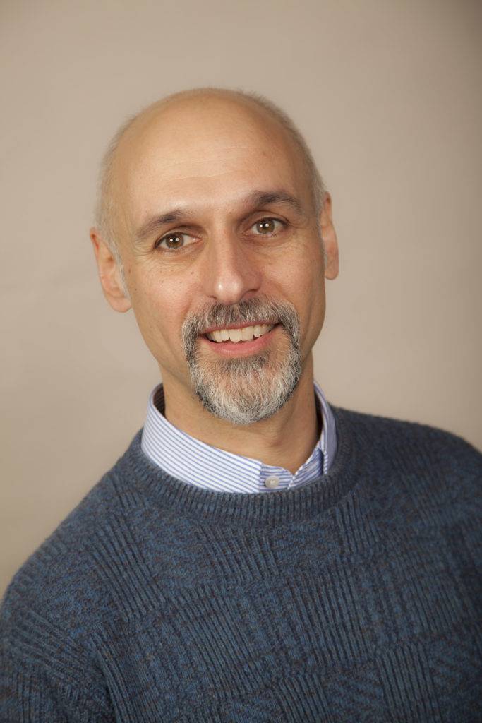 Professional headshot of Ron Cole