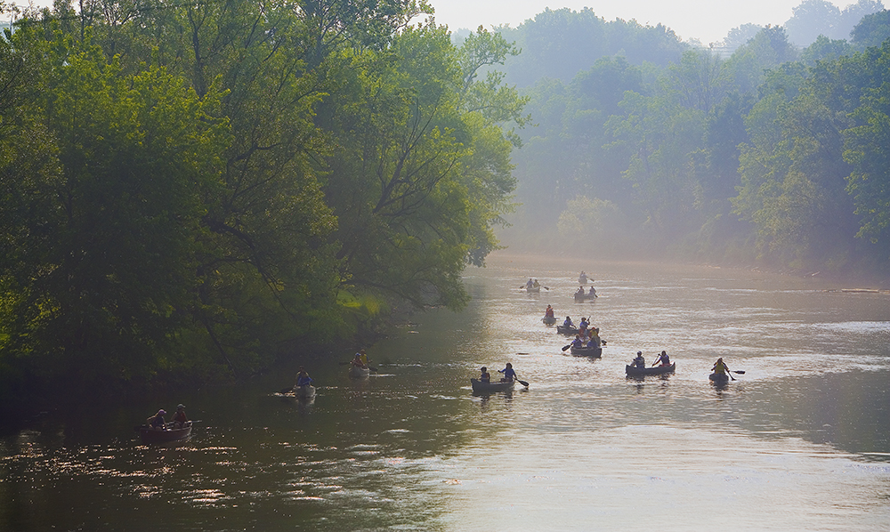 people in canoes traveling down French Creek