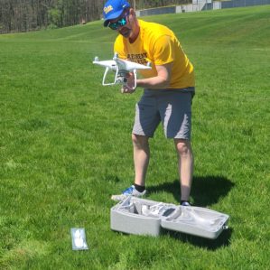 Chris Shaffer with a drone on the campus of Allegheny College
